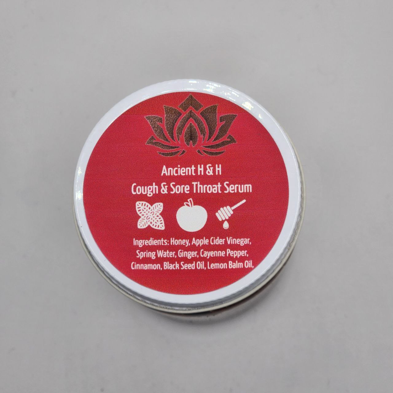 Natural cough & sore throat syrup with raw honey, ginger, and black seed oil for soothing relief.